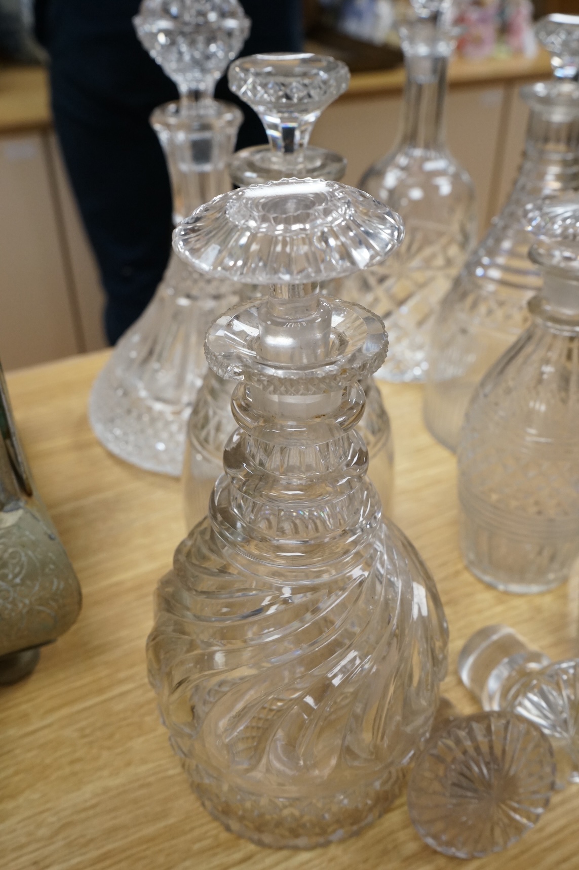 A collection of Regency and later glass decanters and stoppers, tallest 31cm